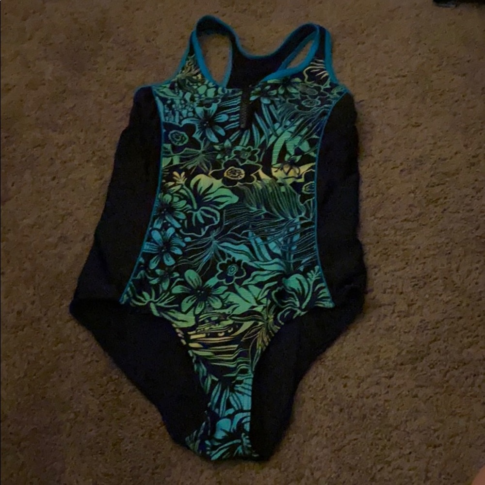 black bathing suit with green Hawaiian flowers